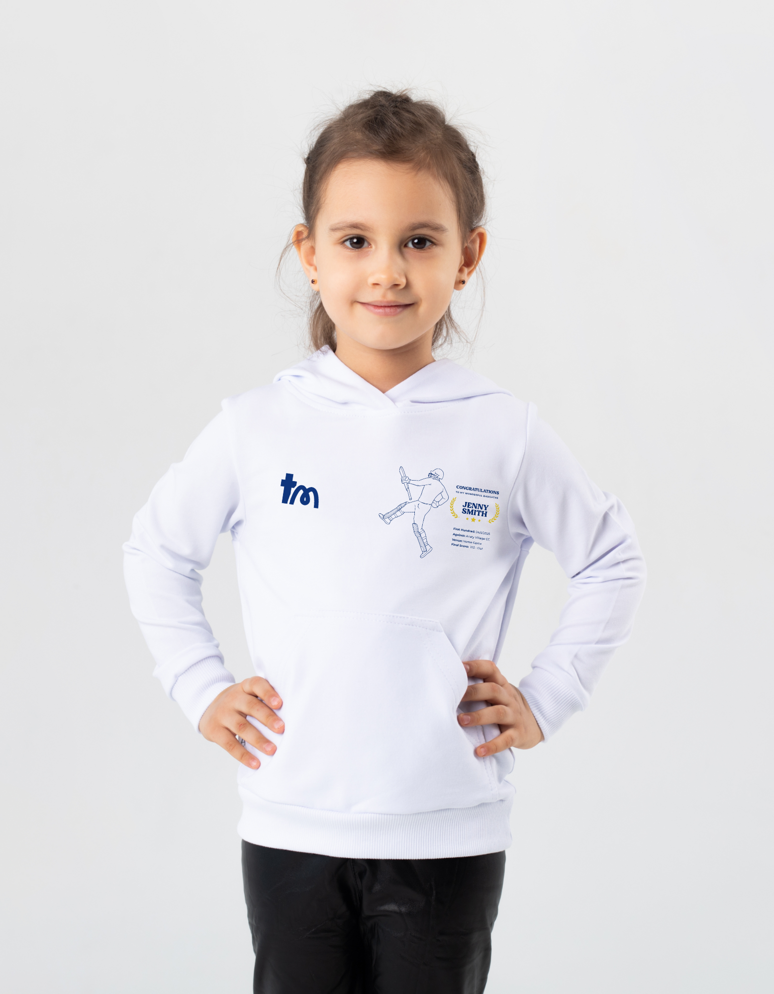 Child wearing a white hoodie with logos on a light gray background - showing the TeeMemento cricket motif and personalisation