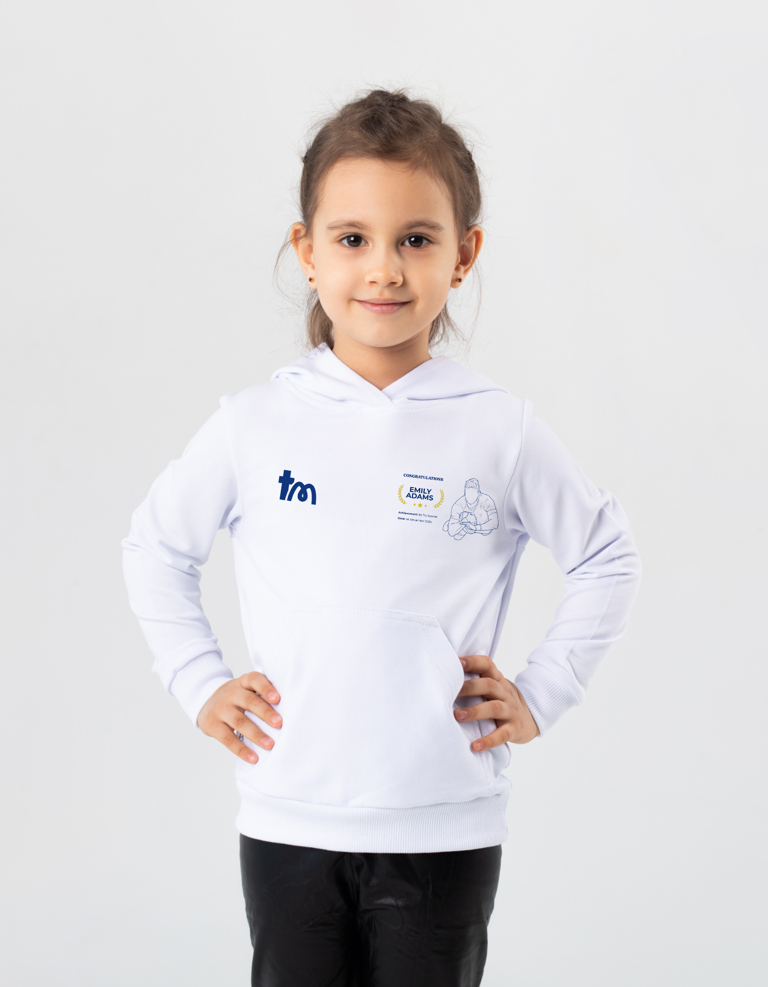Child wearing a white hoodie with logos on a light gray background showcasing a TeeMemento product
