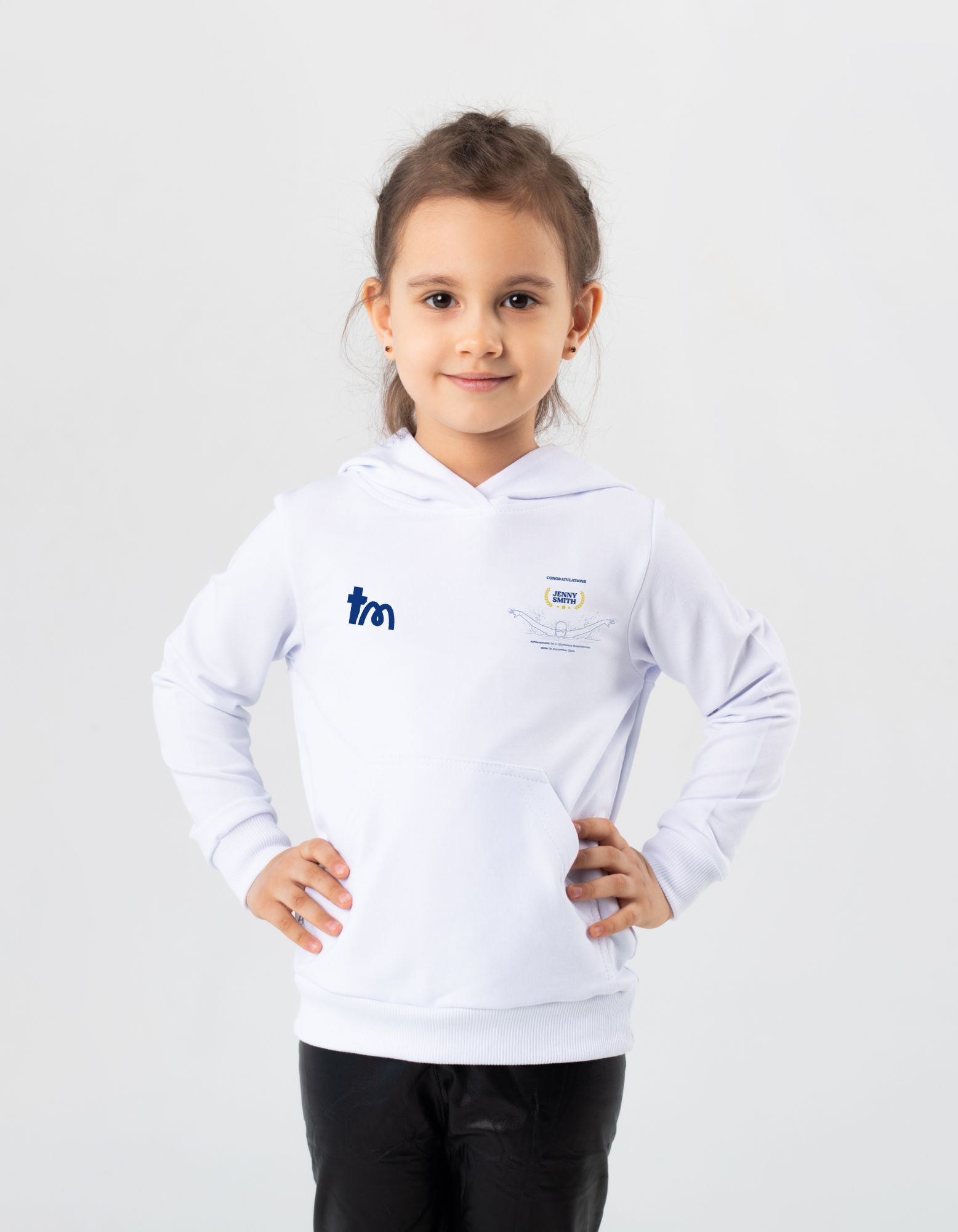 Child wearing a white hoodie with logos on a light gray background showcasing a TeeMemento product