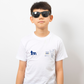 Person wearing a white t-shirt with a logo on a plain background - showing the TeeMemento cricket motif and personalisation